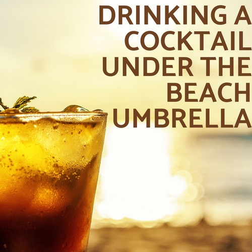 Drinking a Cocktail Under the Beach Umbrella